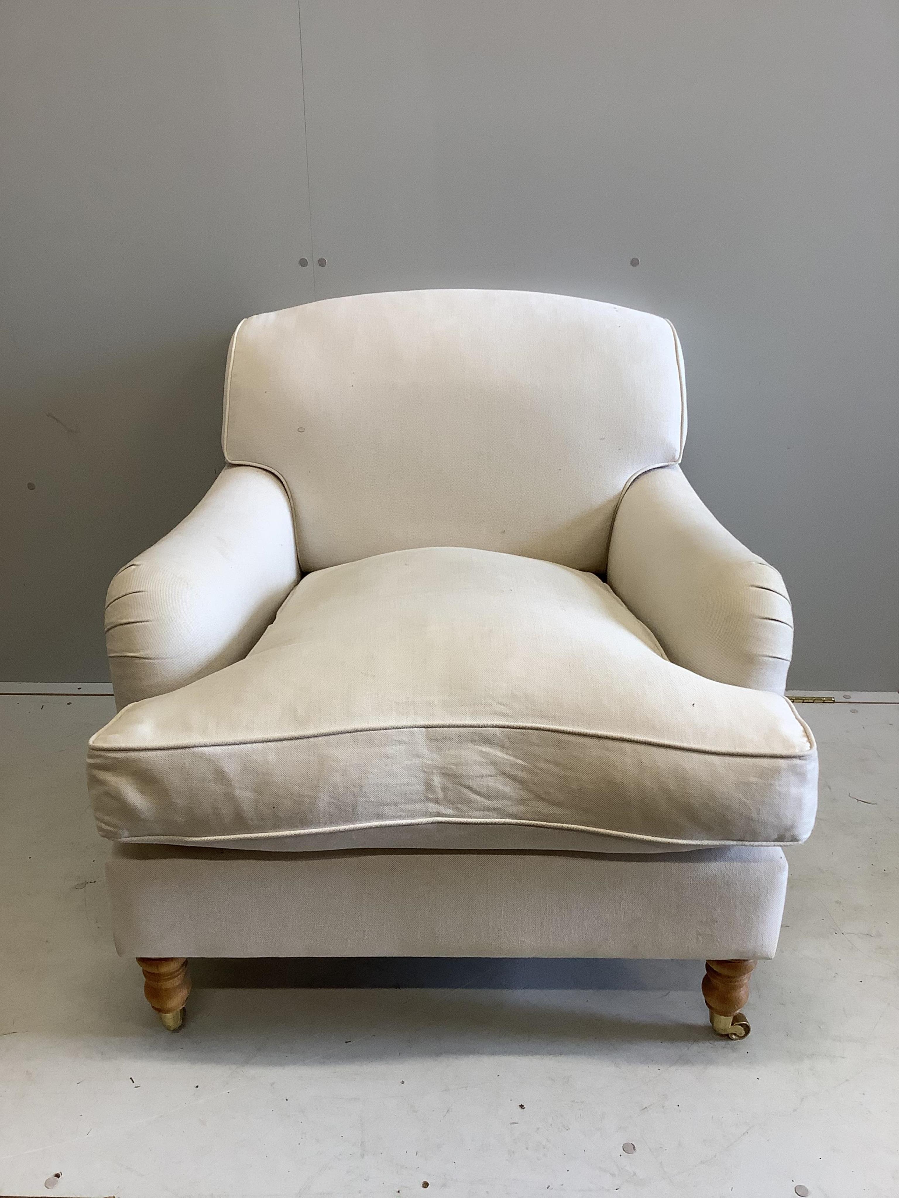 A Contemporary Howard style upholstered armchair, width 88cm, depth 94cm, height 82cm